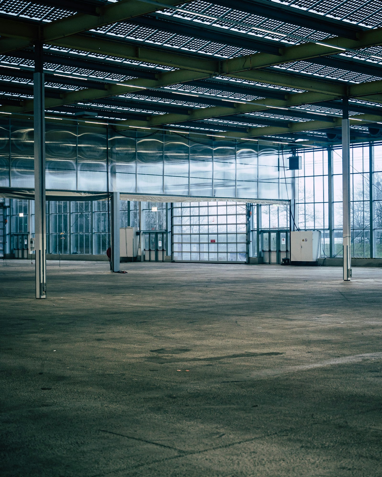 Newly completed Class A warehouse interior with skylit roof and full-height glazing