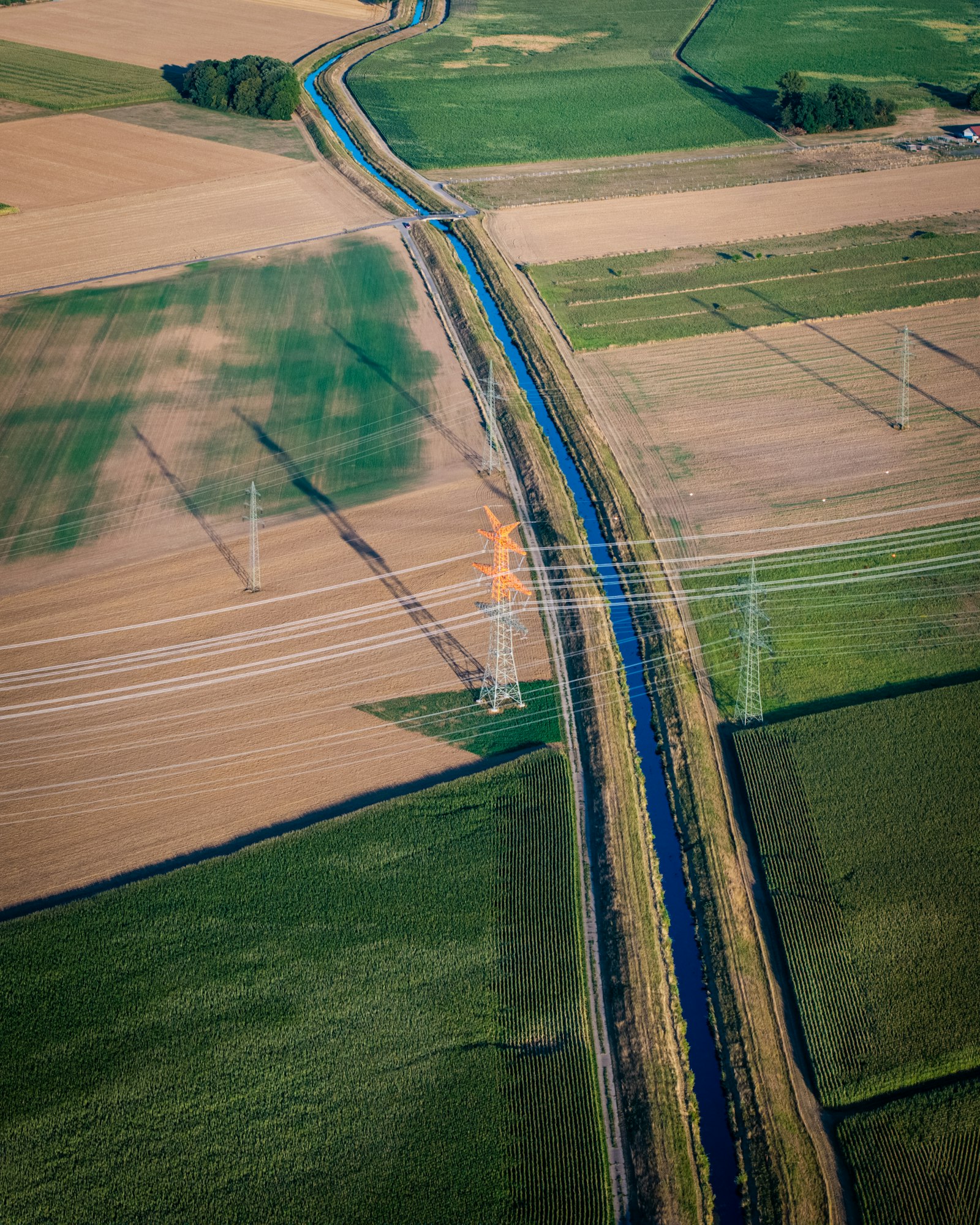 Aerial view of open land with road and utility corridors